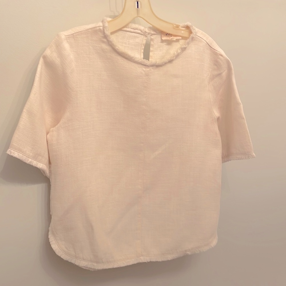 Egg-shell color top with fringe detail